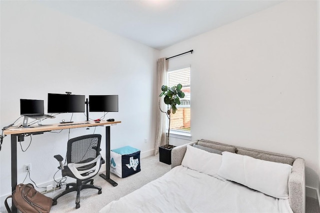 carpeted bedroom featuring baseboards