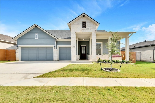 view of front of home featuring an attached garage, a shingled roof, fence, a front yard, and driveway