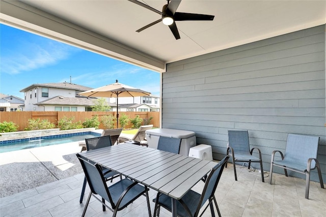 view of patio / terrace featuring outdoor dining space, a fenced in pool, a ceiling fan, and fence