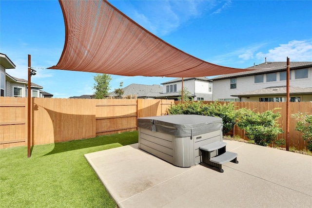 view of patio featuring a fenced backyard and a hot tub