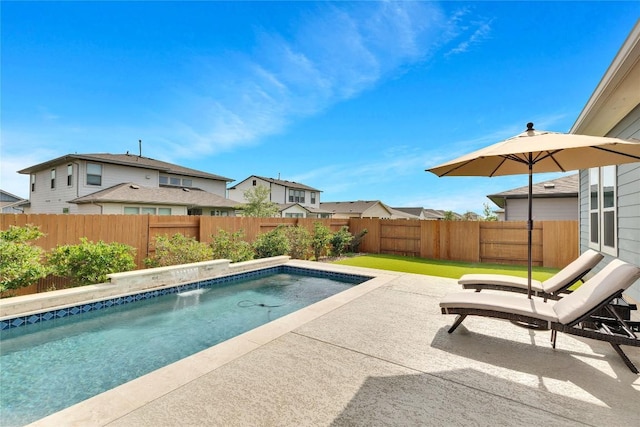 view of swimming pool featuring a patio area, a fenced backyard, a fenced in pool, and a residential view