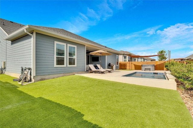 rear view of property with a fenced in pool, roof with shingles, a lawn, a fenced backyard, and a patio