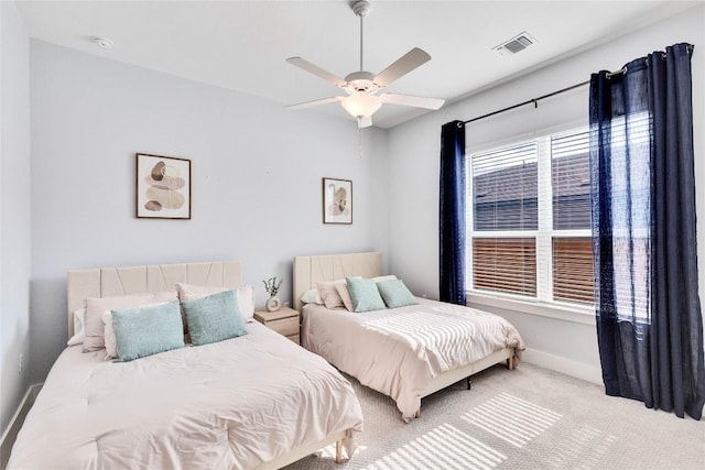 bedroom featuring ceiling fan, carpet, visible vents, and baseboards