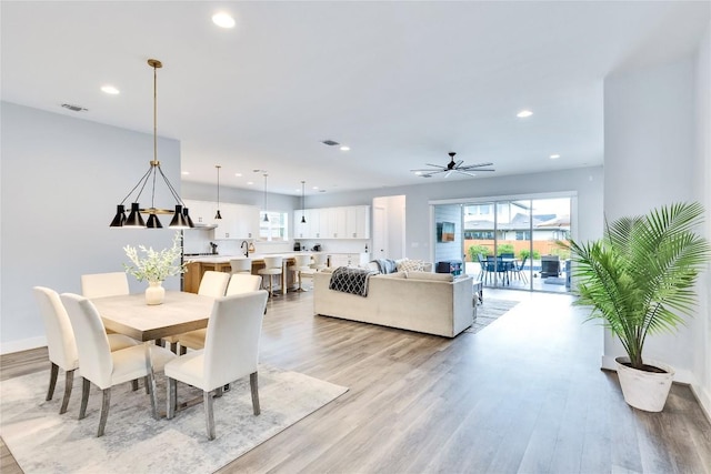 dining room featuring recessed lighting and light wood-style floors