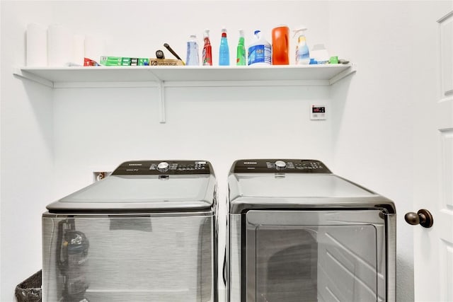 laundry area featuring washer and dryer and laundry area