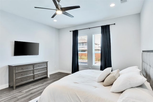 bedroom with visible vents, a ceiling fan, wood finished floors, recessed lighting, and baseboards