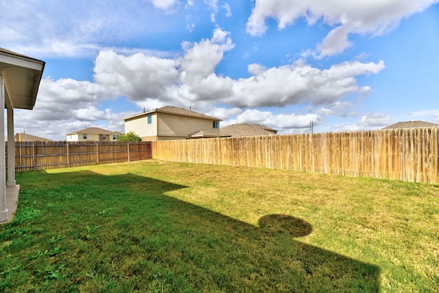 view of yard with a fenced backyard