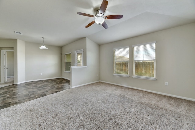 unfurnished living room with visible vents, baseboards, a healthy amount of sunlight, and carpet flooring