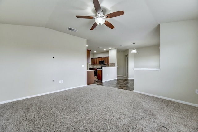 unfurnished living room with recessed lighting, baseboards, visible vents, and dark carpet