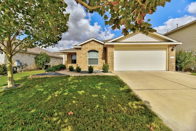 single story home featuring brick siding, a garage, driveway, and a front yard