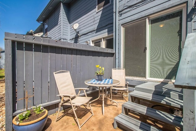 view of patio / terrace with outdoor dining space and fence