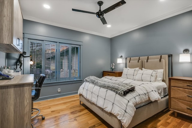 bedroom with a ceiling fan, wood finished floors, baseboards, recessed lighting, and crown molding