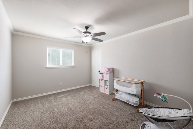 interior space with a ceiling fan, crown molding, and baseboards