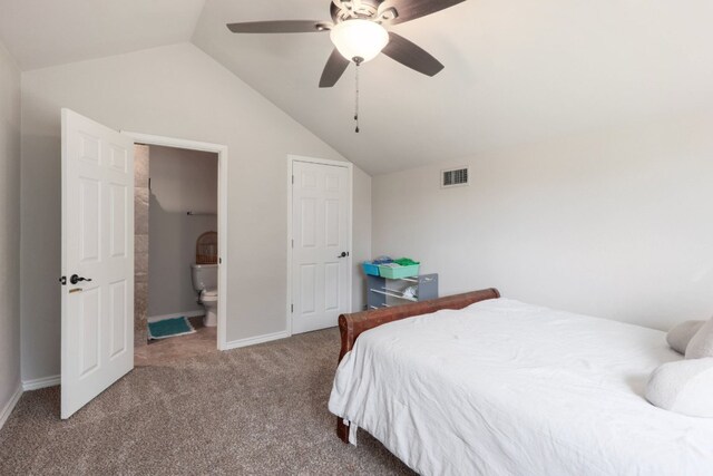 bedroom with visible vents, lofted ceiling, carpet floors, and connected bathroom