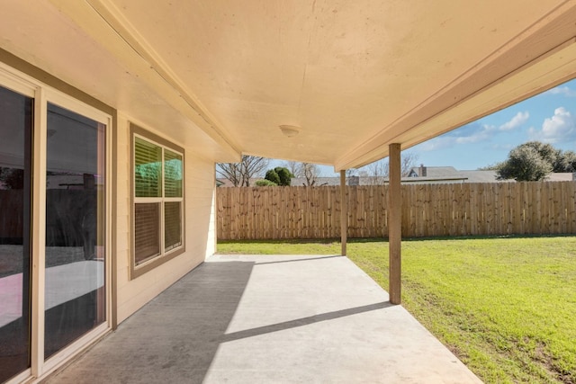 view of patio featuring fence