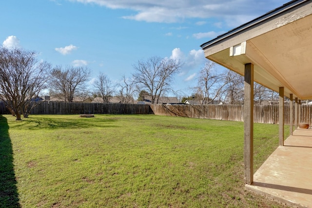 view of yard with a fenced backyard