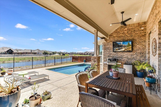 view of pool featuring a ceiling fan, a fenced backyard, a grill, outdoor dining area, and a patio area