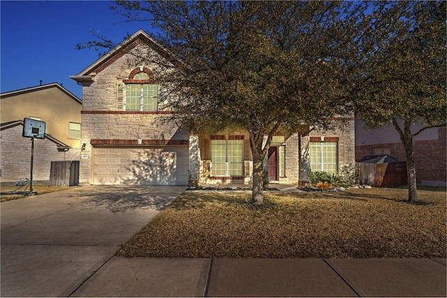 view of front of property with stone siding, driveway, and an attached garage