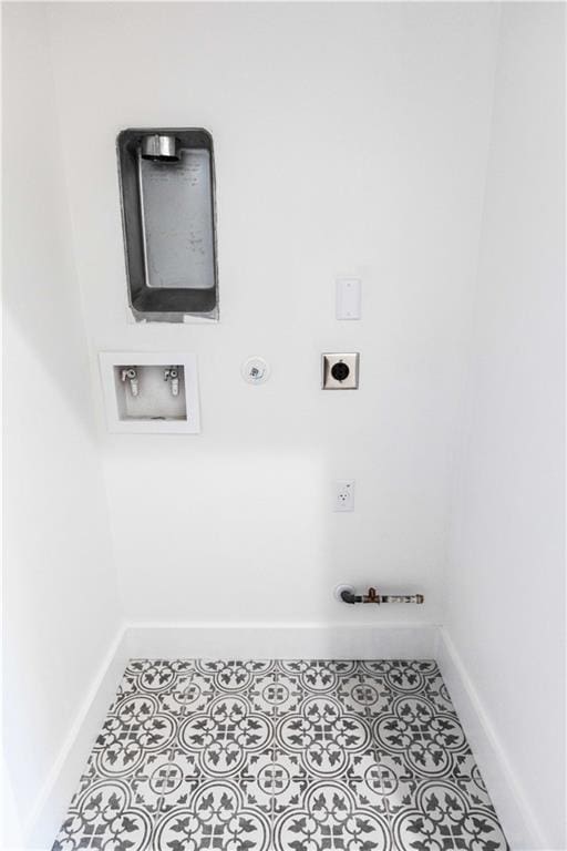 laundry room featuring baseboards, hookup for an electric dryer, gas dryer hookup, laundry area, and tile patterned floors