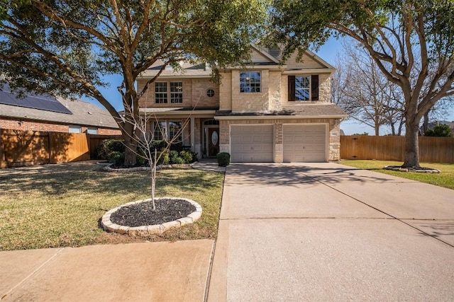 traditional-style home with a front yard, concrete driveway, and fence