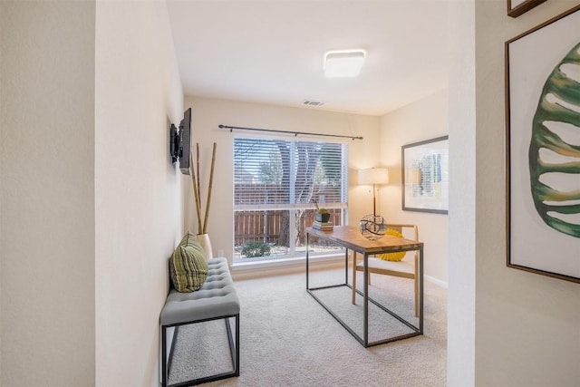 carpeted home office with baseboards and visible vents