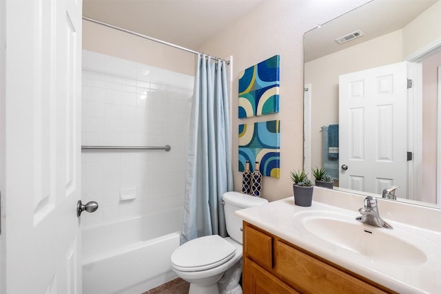 full bath with visible vents, shower / bath combo with shower curtain, toilet, and vanity