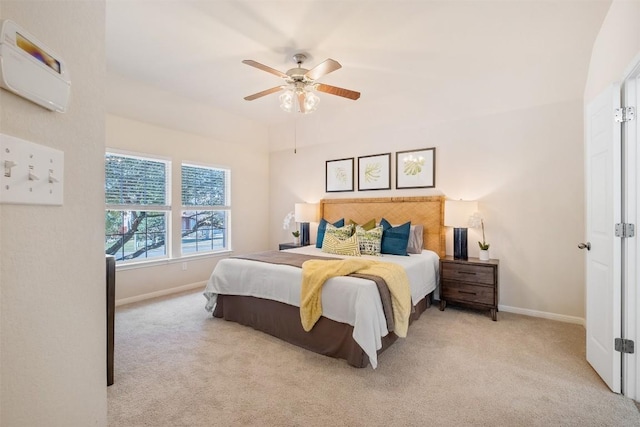 carpeted bedroom featuring a ceiling fan and baseboards