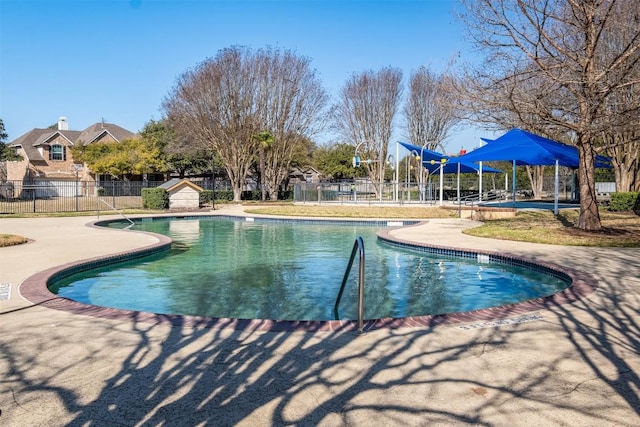 community pool featuring fence