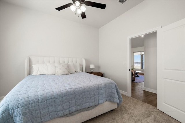 bedroom featuring visible vents, carpet flooring, a ceiling fan, and baseboards