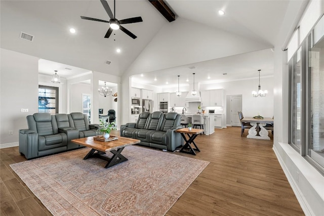 living room featuring visible vents, high vaulted ceiling, beamed ceiling, and wood finished floors