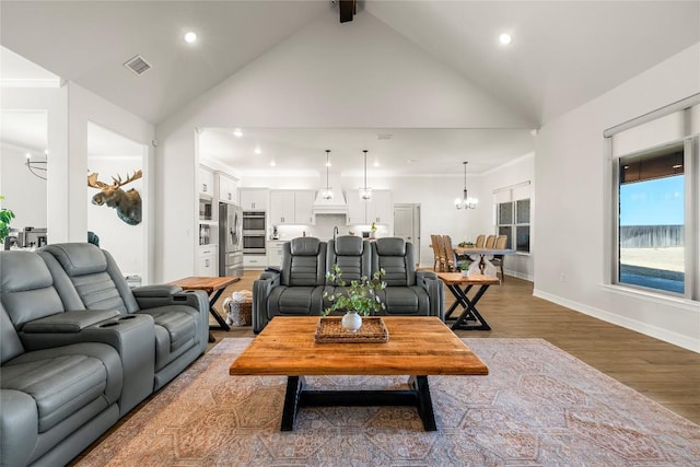 living area featuring visible vents, baseboards, a chandelier, recessed lighting, and wood finished floors