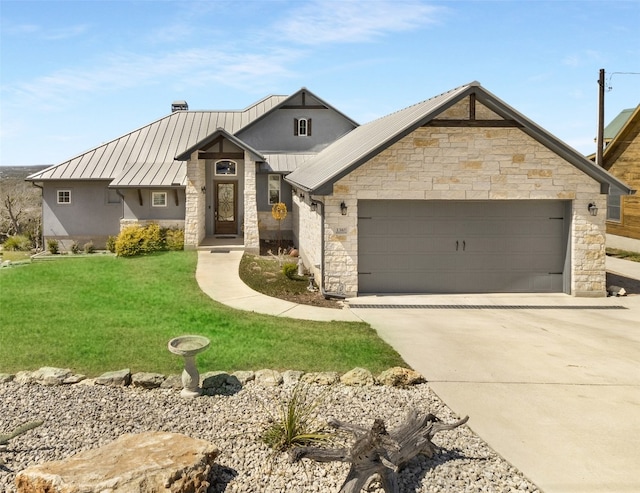 view of front of home with a standing seam roof, an attached garage, concrete driveway, stone siding, and metal roof