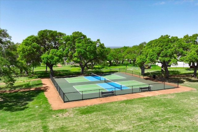 surrounding community with a tennis court, a yard, and fence