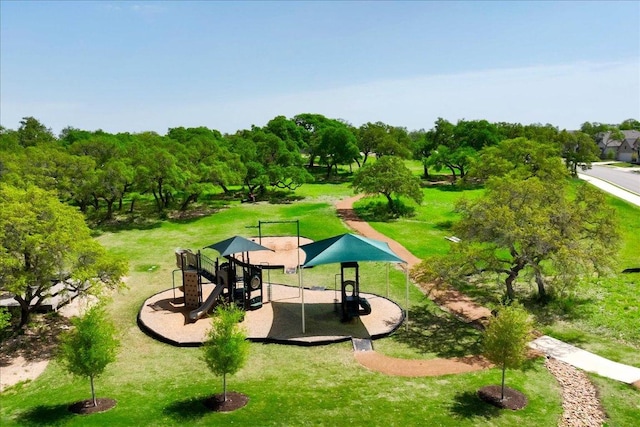 view of community with playground community and a yard