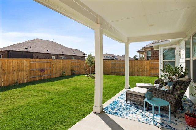 view of yard featuring a patio area and a fenced backyard