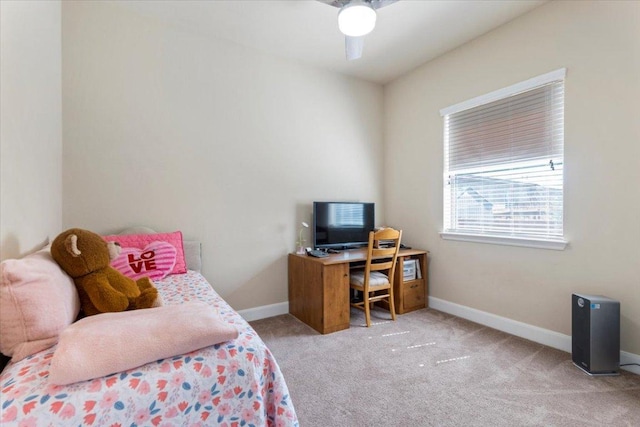 carpeted bedroom featuring baseboards and ceiling fan