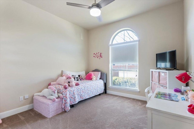 bedroom with a ceiling fan, baseboards, and carpet floors