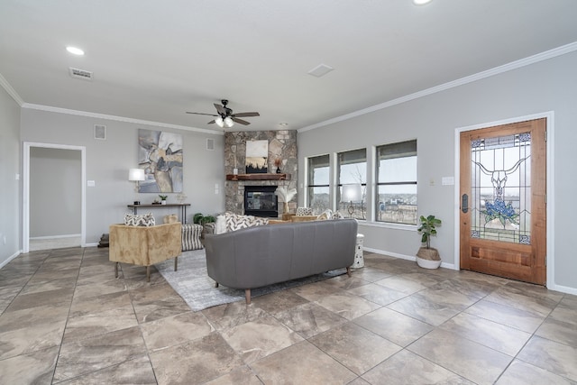 living room featuring visible vents, ornamental molding, and a fireplace