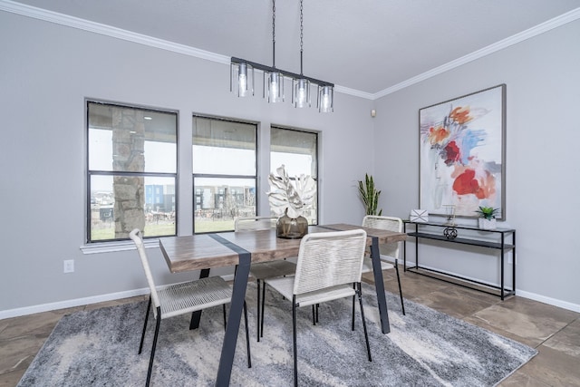 dining room with baseboards and ornamental molding