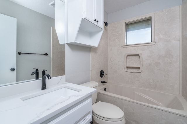 bathroom featuring visible vents, toilet, vanity, and  shower combination