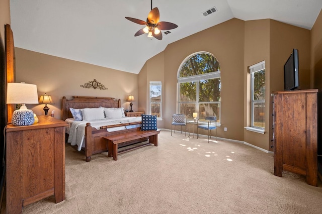 bedroom with visible vents, ceiling fan, baseboards, carpet floors, and high vaulted ceiling