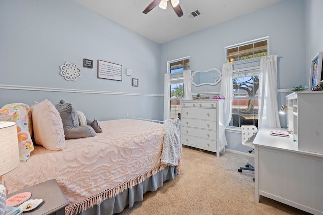 bedroom with carpet flooring, baseboards, visible vents, and ceiling fan