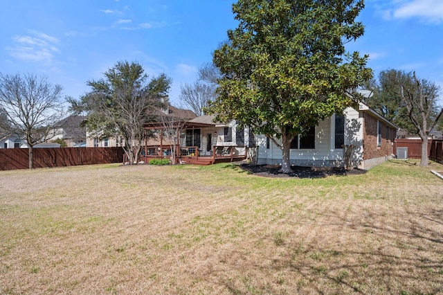 view of yard featuring a wooden deck and fence private yard