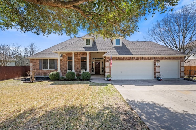 view of front facade featuring a front lawn, an attached garage, and fence