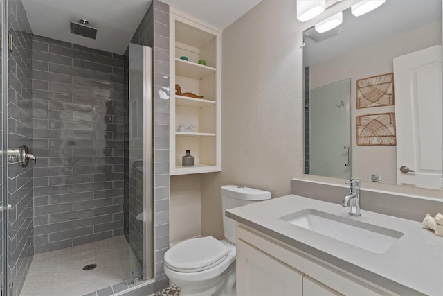 full bathroom with a shower stall, toilet, and vanity