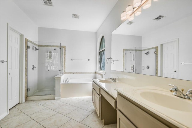 bathroom featuring a bath, visible vents, and a sink