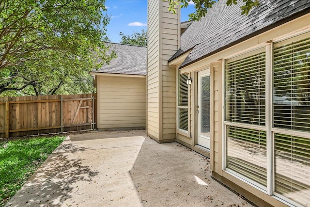 view of patio / terrace featuring fence