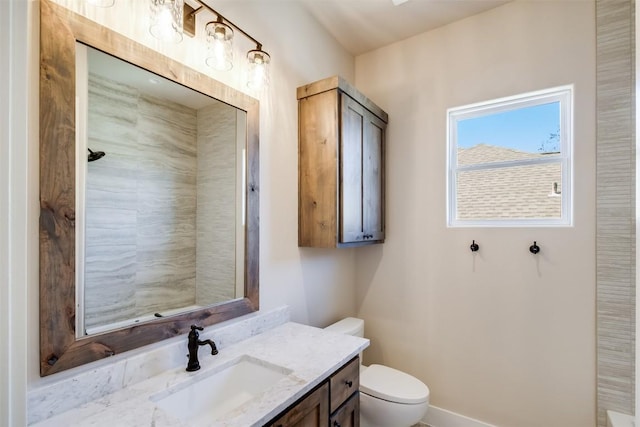 full bathroom with toilet and vanity