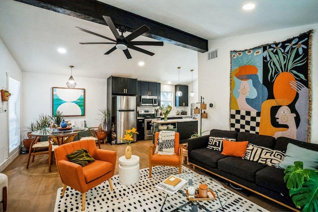 living area featuring visible vents, light wood-type flooring, lofted ceiling with beams, recessed lighting, and ceiling fan