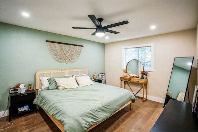 bedroom featuring recessed lighting, wood finished floors, baseboards, and ceiling fan